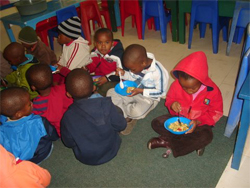 Kindergarten pupils enjoying their home-made soup